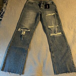 Women's Mid Blue Vintage Wash Ripped Straight Leg Jeans. Waist 30” length 40”